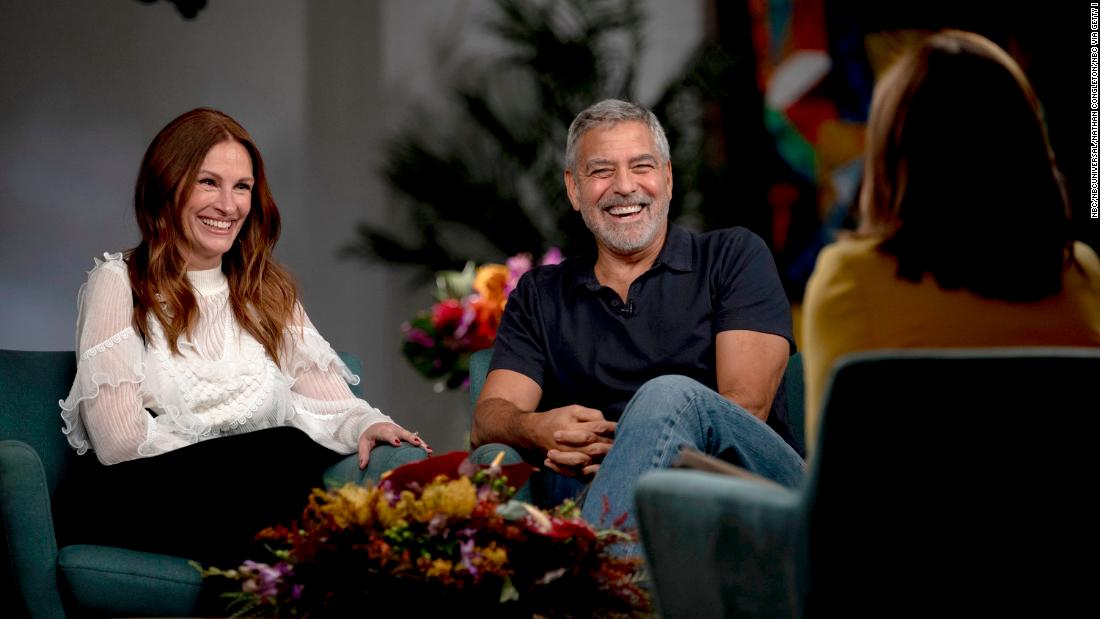 'Get 'em out!': Julia Roberts and George Clooney laugh about kissing on set when family visits