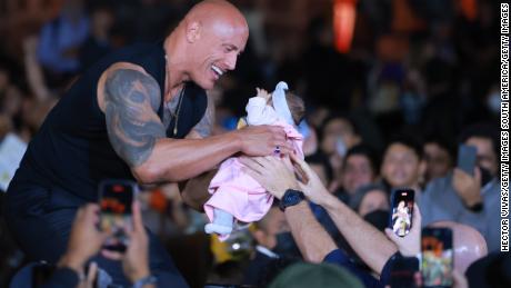 &#39;The Rock&#39; thought a fan handed him a toy doll. It was a baby. See the moment