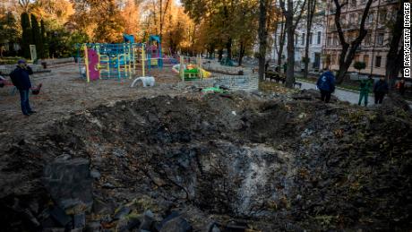 A crater left by a missile strike next to a children&#39;s playground in Kyiv on Monday.