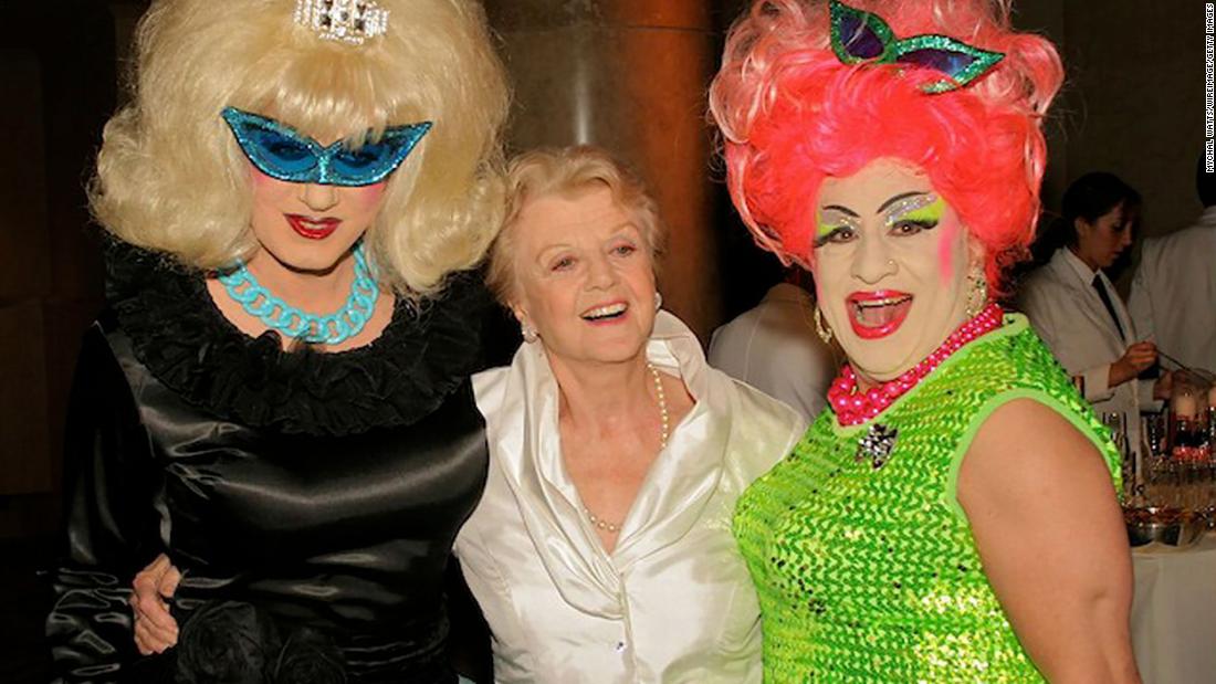 Lansbury poses with drag queens Brandy Wine and Brenda A. Go-Go during a costume ball in New York in 2006.