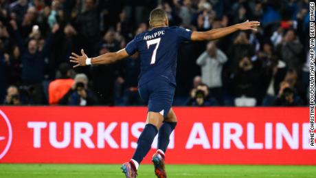 Mbappe celebrates scoring his penalty against Benfica.