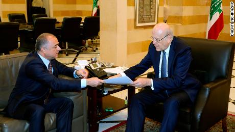 Lebanese Prime Minister Najib Makati (R) receives the final draft of the maritime border agreement between Lebanon and Israel from his deputy Elias Bou Saab (L) who leads the Lebanese negotiating team, in Beirut, Lebanon on Tuesday. 