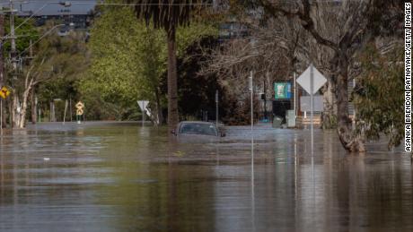 Man found dead in flooded backyard as Australia braces for more heavy rain