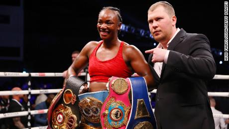 Shields celebrates victory with her belts after the WBO, WBA, IBO and WBF Women&#39;s Middleweight Title fight against Erna Kozin.