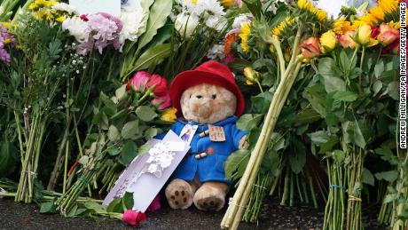 Floral tributes and a Paddington teddy bear are laid at the gates of Balmoral in Scotland, following the death of Queen Elizabeth II on Thursday. Picture date: Friday September 9, 2022. 