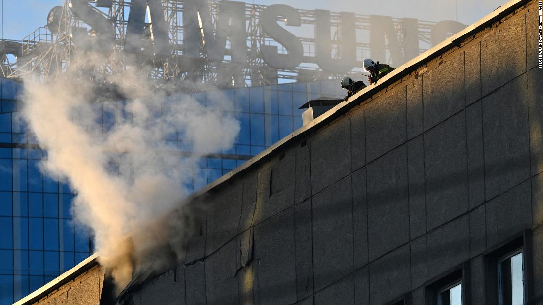 Ukrainian rescuers work on a roof after a drone attack in Kyiv on Monday.