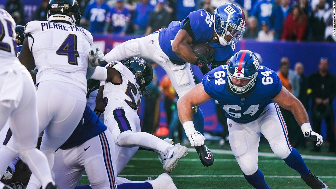 New York Giants running back Saquon Barkley dives into the endzone to score a touchdown during the second half against the Baltimore Ravens. The Giants continued their excellent start to the season with a 24-20 win over the Ravens, improving their record to 5-1.