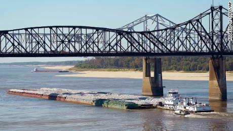 Low water restrictions on the barge loads make for cautious navigation through the Mississippi River in Vicksburg, Mississippi, on October 11.