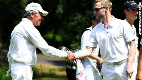 Player greets Keating during the Gary Player Invitational at Wentworth Golf Club, England in 2013.