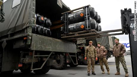 Ukrainian servicemen load a truck with the FGM-148 Javelin, American man-portable anti-tank missile provided by US to Ukraine as part of a military support, upon its delivery at Kyiv&#39;s airport Boryspil on February 11,2022, amid the crisis linked with the threat of Russia&#39;s invasion.