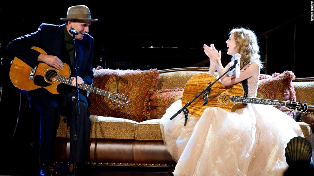 Swift performs with James Taylor at Madison Square Garden in 2011. She had two sold-out shows at the venue. Before this performance, Swift told the audience she&#39;s named after James Taylor. She also mentions Taylor in her song &quot;Begin Again.&quot;