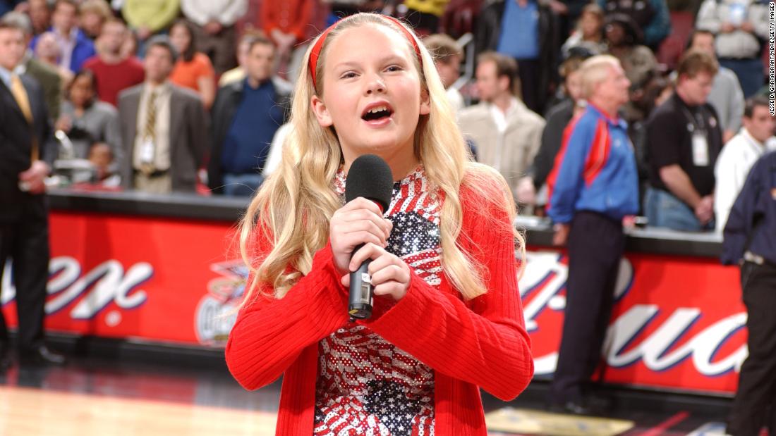 A 13-year-old Swift sings the National Anthem before an NBA game in Philadelphia in 2002.