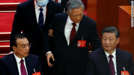 Former Chinese leader Hu Jintao unexpectedly led out of room as Party Congress comes to a close