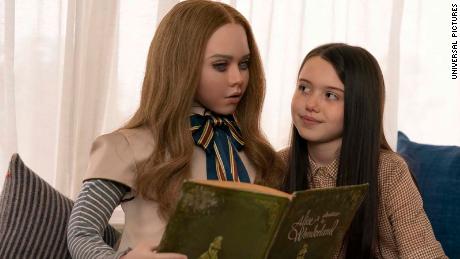 In &#39;M3GAN,&#39; Cady (Violet McGraw, right) is gited a hi-tech new friend. 