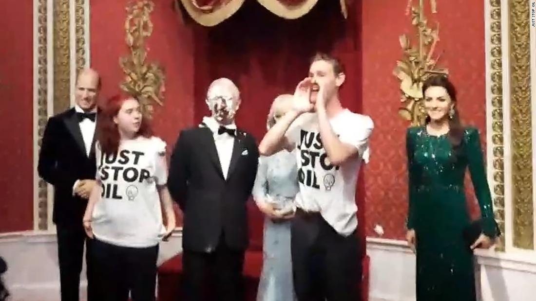 Fossil fuel protesters cover King Charles III waxwork with chocolate cake at Madame Tussauds