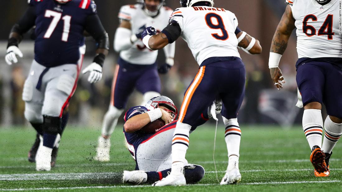 New England Patriots quarterback Mac Jones slides and accidentally kicks Chicago Bears safety Jaquan Brisker in the groin. Later on in the drive, Brisker got his revenge though with an impressive one-handed interception — one of three picks on the evening for &quot;Da Bears&quot; in a 33-14 win for Chicago.