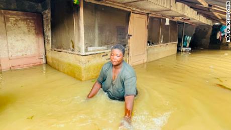 Flooding in Nigeria&#39;s Bayelsa state has forced people to wade through waiste-high water.