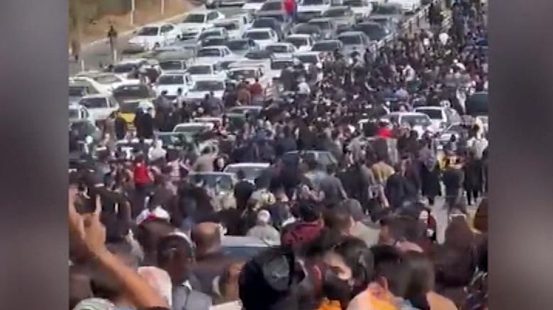 Protesters bring traffic to a standstill as thousands gather at Mahsa Amini's grave