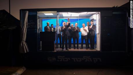 Former Israeli Prime Minster and Likud party leader Benjamin Netanyahu speaks to supporters in a modified truck during a campaign event on October 6 in Hadera, Israel. 