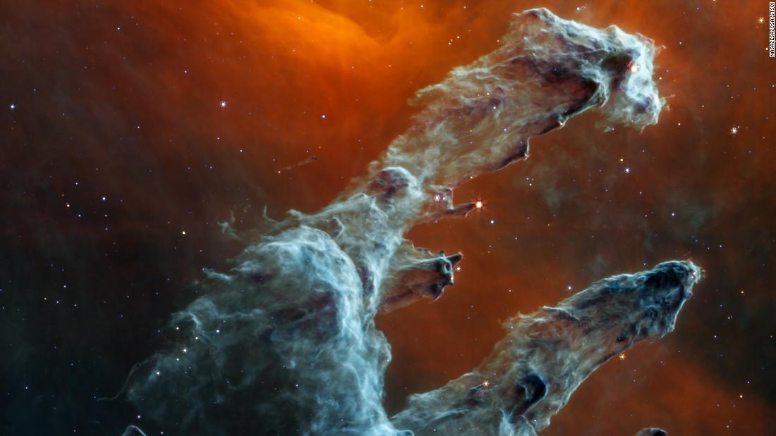 The James Webb Space Telescope captured a new perspective of the Pillars of Creation in mid-infrared light. The dust of this star-forming region, rather than the stars themselves, is the highlight, and resembles ghostly figures.