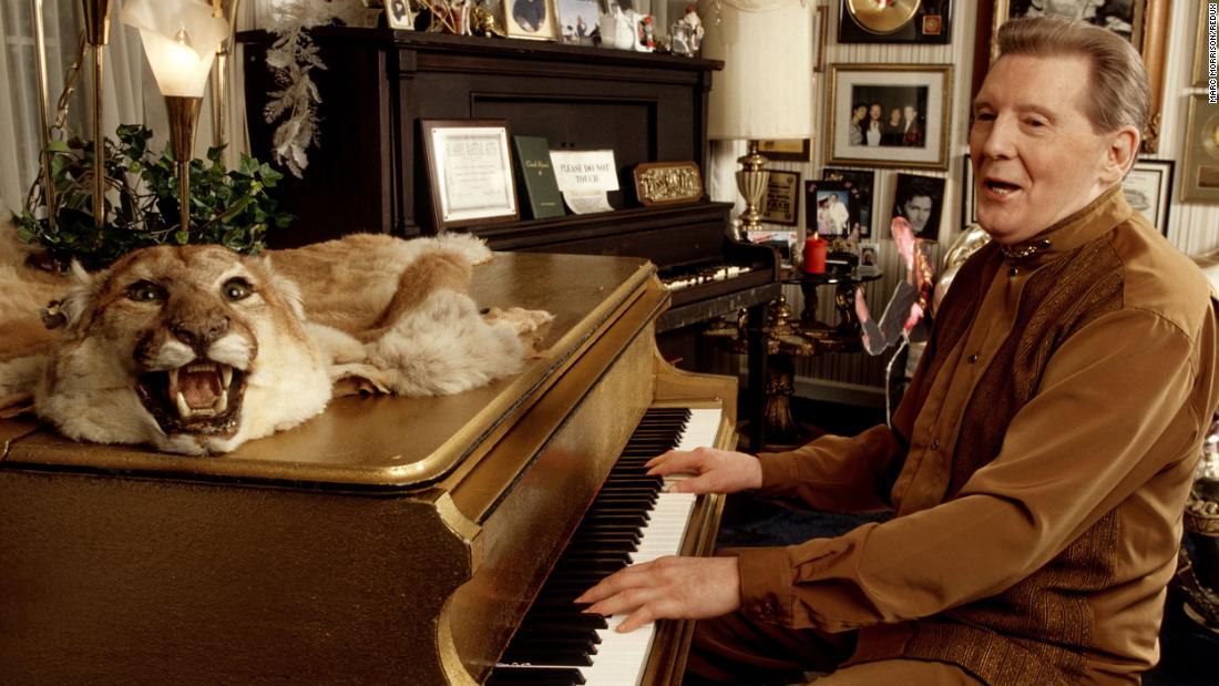 Lewis plays the piano at his home in Mississippi in 1999.