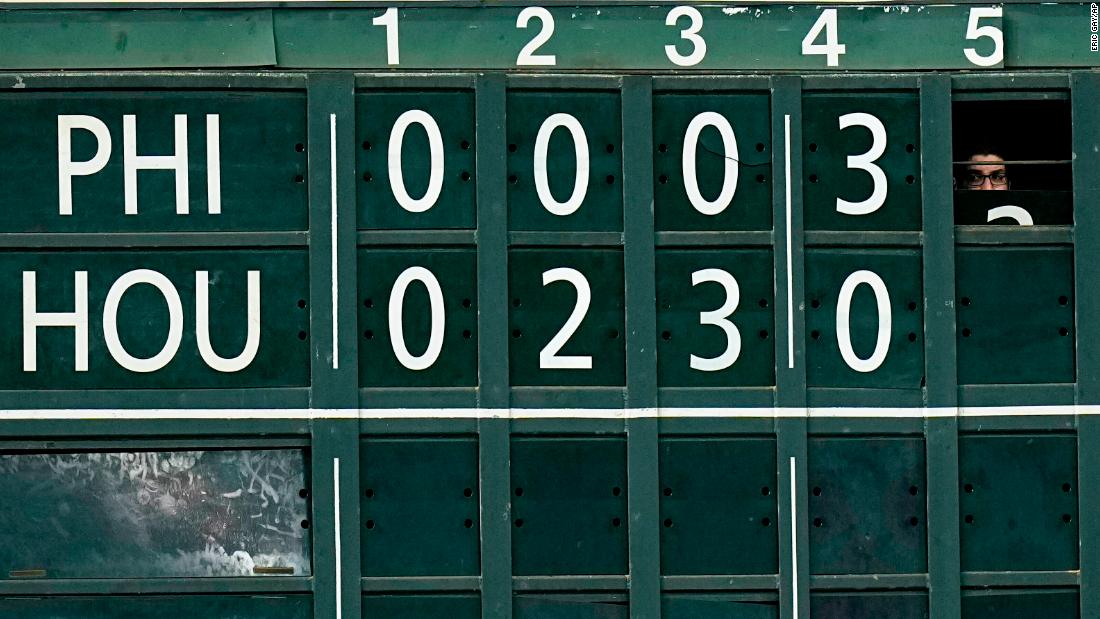 A scoreboard worker at Minute Maid Park changes the number during the top of the fifth inning, when the Phillies tied the game at 5-5.