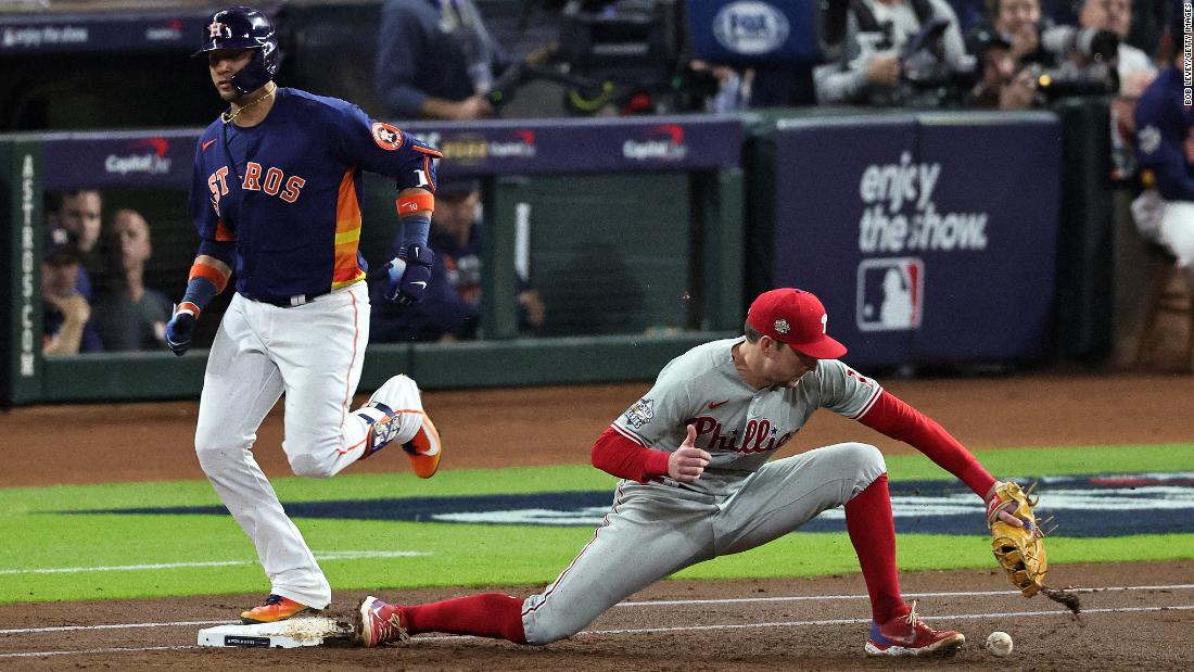 Philadelphia first baseman Rhys Hoskins mishandles the ball in the first inning of Game 2, allowing Yuri Gurriel to reach safely. It cost the Phillies a run, as Álvarez scored on the error.