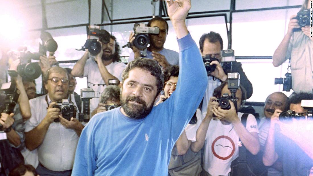 As a first-time presidential candidate, Lula displays his vote before placing it in a ballot box in Rio de Janeiro in 1989. Lula ran in Brazil&#39;s first democratic elections since 1960.