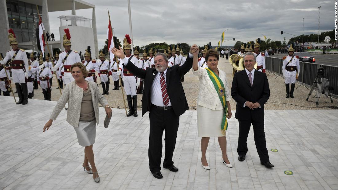 Outgoing President Lula da Silva and his wife Marisa leave the Planalto Palace with newly sworn-in Brazilian President Dilma Rousseff and Vice President Michel Temer in Brasilia in 2011. Rousseff beat opposition candidate Jose Serra in a run-off election to become the South American nation&#39;s first female president.
