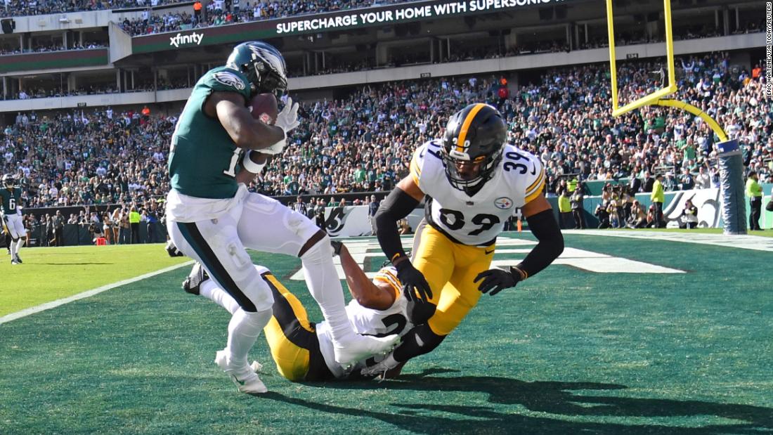 Philadelphia Eagles wide receiver A.J. Brown catches a 29-yard touchdown pass against Pittsburgh Steelers cornerback Ahkello Witherspoon and safety Minkah Fitzpatrick. Brown caught three touchdown passes as the Eagles remained undefeated with a 35-13 victory over the Steelers to move to 7-0 for the season. 