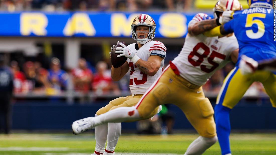 San Francisco 49ers running back Christian McCaffrey throws a touchdown pass to Brandon Aiyuk against the Los Angeles Rams. McCaffrey equaled a rare record in the 49ers 31-14 victory, becoming the first NFL player since Hall of Famer LaDainian Tomlinson in 2005 to have a passing, rushing and receiving touchdown in a game. 