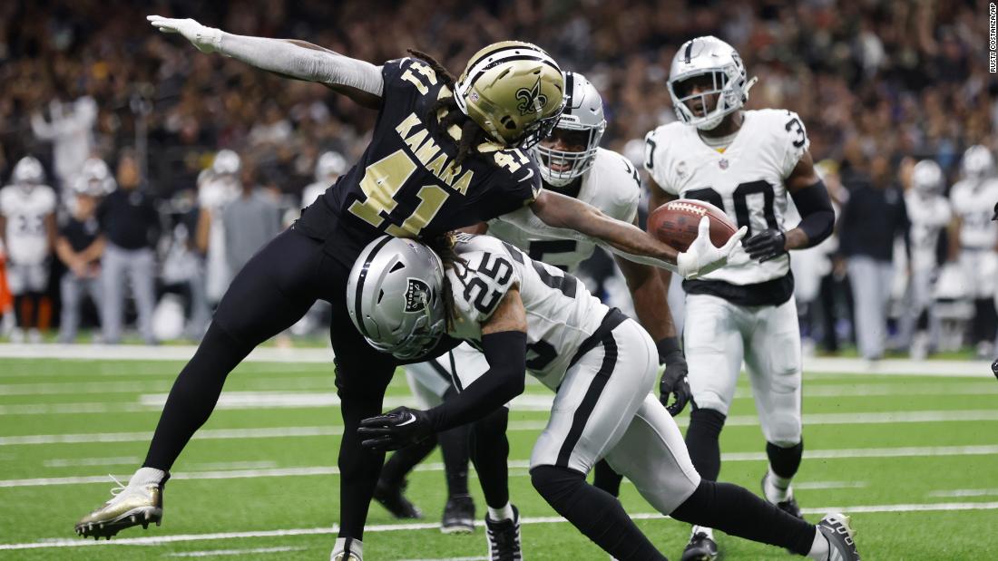 New Orleans Saints running back Alvin Kamara stretches across the goal line for a touchdown against the Las Vegas Raiders. The Saints shut out the Raiders, intercepting quarterback Derek Carr once, on the way to a 24-0 win. 