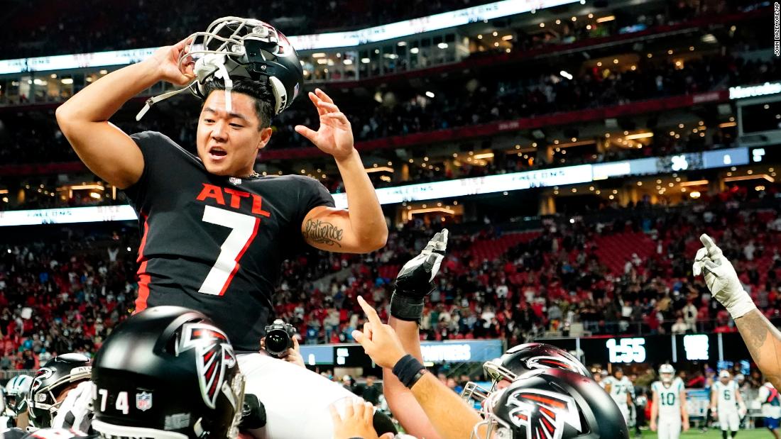 Atlanta Falcons kicker&lt;a href=&quot;https://edition.cnn.com/2022/09/11/sport/younghoe-koo-atlanta-falcons-nfl-spt-intl/index.html&quot; target=&quot;_blank&quot;&gt; Younghoe Koo&lt;/a&gt; is congratulated by teammates after kicking the game-winning field goal in overtime against the Carolina Panthers. Regular time ended in dramatic fashion after Panthers quarterback PJ Walker completed a huge Hail Mary touchdown pass to tie the scores but kicker Eddy Pineiro missed two key kicks which would have given Carolina the victory. In the end, Koo&#39;s overtime field goal gave the Falcons the 37-34 victory. 