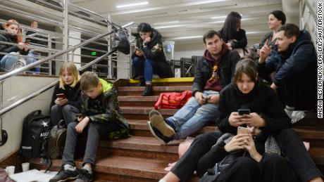 Ukrainians shelter inside a metro station after a missile attack in Kyiv on Monday.