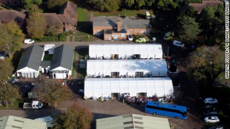 Warnings grow of dire conditions at migrant processing center in England