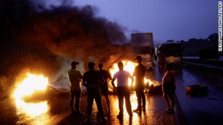 Supporters of Brazil&#39;s President Jair Bolsonaro blocking a highway near Abadiania, central Brazil.