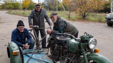Villagers are pictured in a formerly Russian-occupied town in southern Ukraine&#39;s Kherson region.