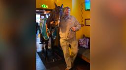 221102130221 peta racehorse grab hp video PETA: Animal rights organization criticizes trainer for parading racehorse in pub