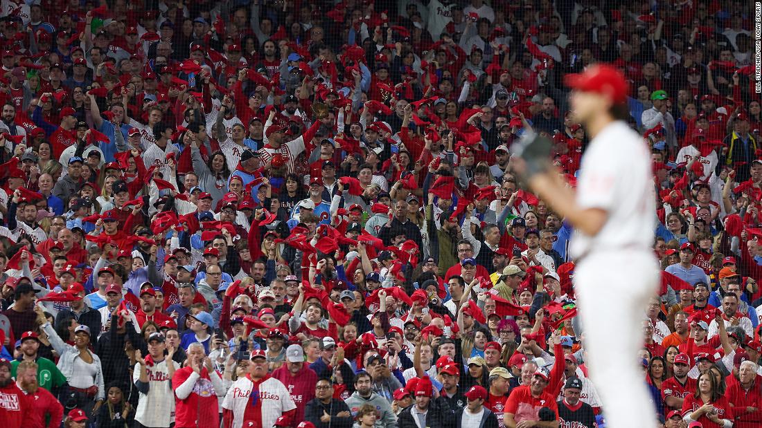 Fans wave towels as Philadelphia&#39;s Aaron Nola prepares to pitch during Game 4.