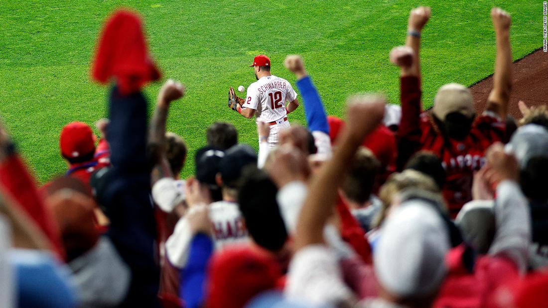 Fans react as Kyle Schwarber of the Phillies makes a catch for an out on Wednesday.