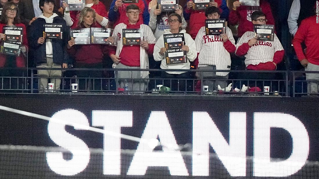 &lt;a href=&quot;https://www.cnn.com/2022/10/31/politics/jill-biden-world-series-philadelphia&quot; target=&quot;_blank&quot;&gt;First lady Jill Biden&lt;/a&gt;, third from left in front, hold signs for a Stand Up To Cancer campaign after the fifth inning of Game 4. The first lady attended the game in Philadelphia as part of the Biden administration&#39;s Cancer Moonshot initiative. She has made her love of the Phillies well known and has longstanding ties to the city.