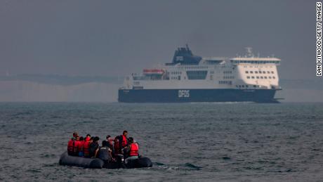 An inflatable craft carries migrants across the English Channel.