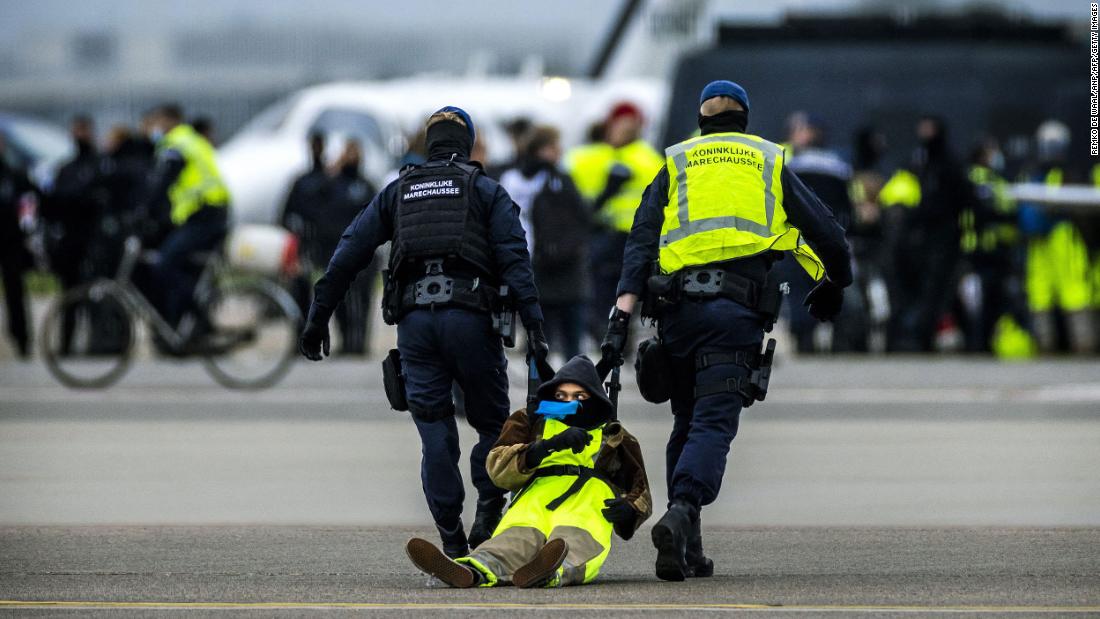 Climate activists block private jet runway at Schiphol Airport in Amsterdam