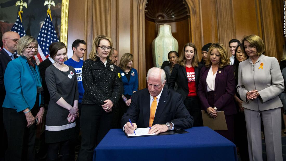 Giffords watches US Rep. Mike Thompson sign a 2019 bill that would expand background checks for sales of firearms. It did not make it through the Senate.