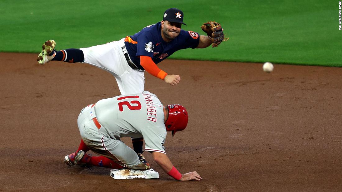 Astros second baseman Jose Altuve turns a double play in the first inning of Saturday&#39;s game.