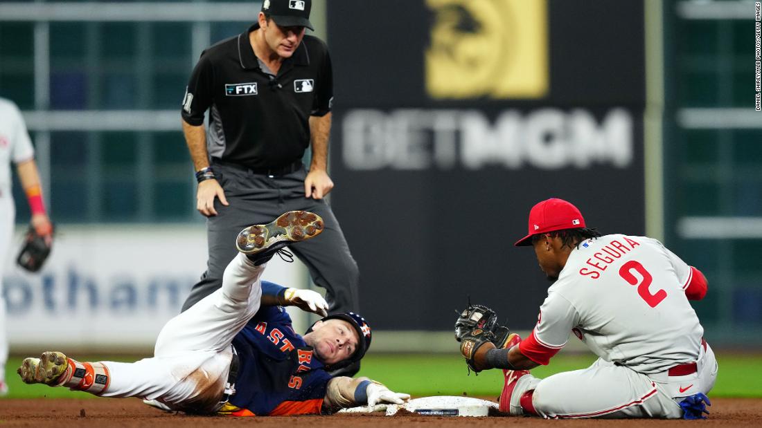 Houston infielder Alex Bregman is tagged out by Jean Segura while sliding into second base in the eighth inning of Saturday&#39;s game. Bregman was initially called safe on the play but the call was overturned after an official review.
