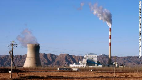 Smoke rises from the chimney of a coal-fired power plant in Gansu Province, China, in February. China and the US have historically been the largest greenhouse gas emitters.