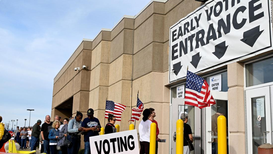 People wait in line to cast their ballots in Columbus on November 5.