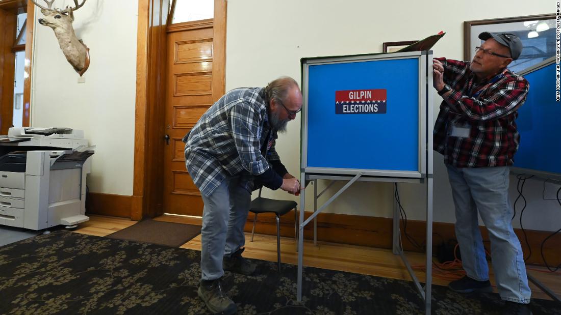 Election workers Greg Petty, left, and Richard Conklin close down a voting station in Central City, Colorado, at the end of the day on November 4.