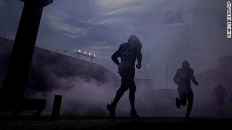 Kansas State players run onto the field before an NCAA college football game against Texas Tech Saturday, Oct. 1, 2022, in Manhattan, Kan. (AP Photo/Charlie Riedel)
